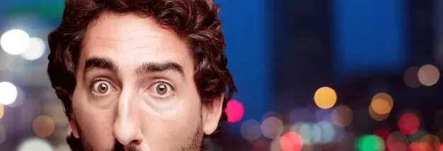 A close-up shot of an audience member with a tear in their eye, looking intently at the stage during an award show. The blurred background shows lights and silhouettes of other attendees. This intimate moment captures the emotional impact of speeches on viewers.