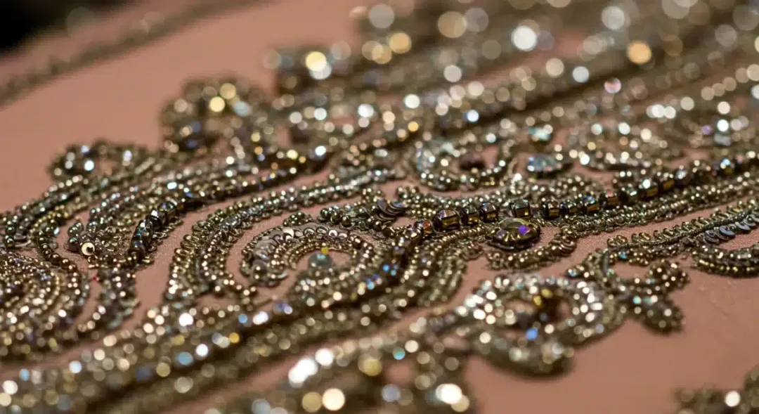Intricate hand-embroidery on a luxury gown