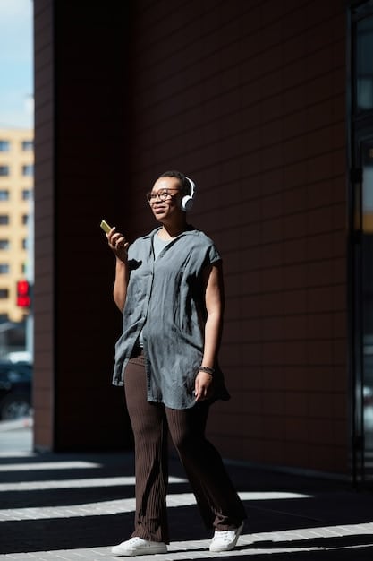 An image showing a celebrity PR professional talking on the phone while walking through a busy studio lot. The photo is candid and captures the fast-paced environment of the entertainment industry.