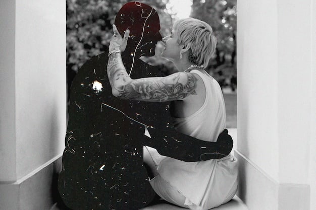 A black and white photo of a celebrity couple embracing tenderly, conveying a sense of deep emotional connection and genuine affection.