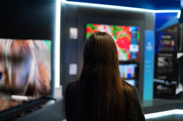 A behind-the-scenes shot of a reality TV set, focusing on the control room with multiple screens displaying different angles of a celebrity couple interacting. The setting is dimly lit, emphasizing the technical aspect of constructing the narrative.