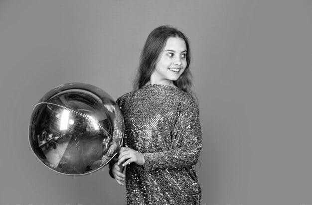 A candid black and white photograph showing a hypothetical Golden Globe winner backstage, surrounded by their team and family, all celebrating with champagne. Their face is illuminated with joy and relief.