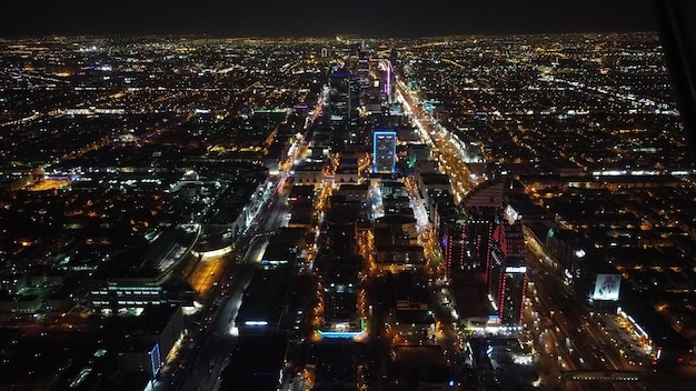 Aerial view of downtown Los Angeles, showcasing the city's skyline, bustling streets, and iconic entertainment venues like the Staples Center and the Hollywood Bowl.