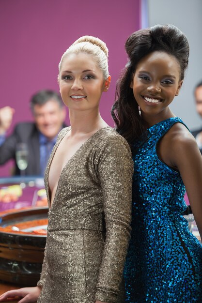 A photo of diverse nominees at an awards show, smiling and posing for the cameras.