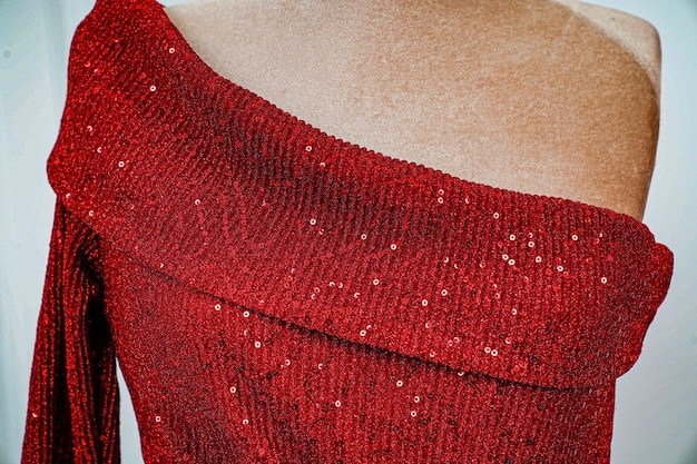 A close-up shot of a red carpet outfit with several clear fashion errors: a dress that's too tight, causing visible straining; clashing accessories; and makeup that doesn't match the skin tone. Focus on capturing the details of the mistakes.