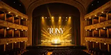 Empty Broadway theater stage awaiting the 2026 Tony Awards, with golden lighting.