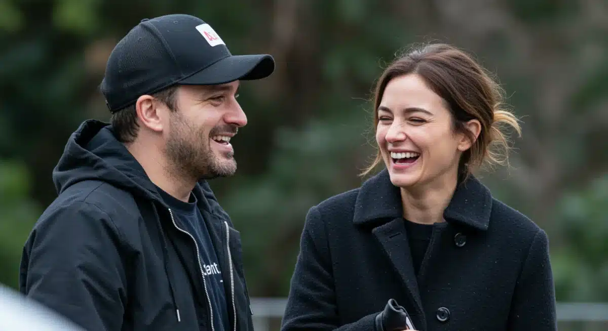Candid moment of a celebrity power couple sharing a laugh, highlighting their personal connection beyond the spotlight.
