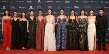 Celebrities on a red carpet wearing avant-garde designs by emerging fashion talents.