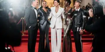 Five influential fashion stylists on a red carpet, embodying the power of stylist red carpet influence for 2026.